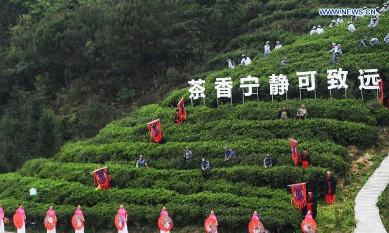 People attend a tea culture festival in Zhongyi Village under Dazu District of southwest China's Chongqing Municipality on March 18, 2021. The cultural event is aimed at promoting local tourism. Photo: Xinhua