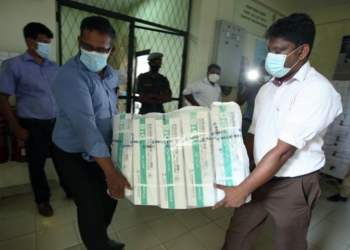 Workers transport Sinopharm COVID-19 vaccines at the Bandaranaike International Airport in Colombo, Sri Lanka, March 31, 2021. A batch of Sinopharm vaccines arrived in Sri Lanka from China on Wednesday as part of a donation by the Chinese government to the island nation.Photo:Xinhua