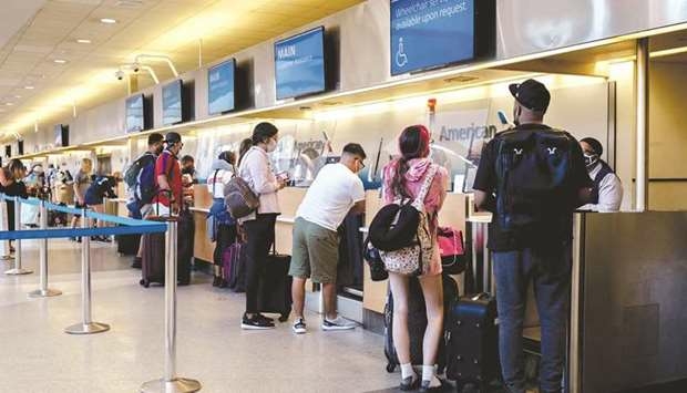 Travellers at an American Airlines check-in counter at Philadelphia International Airport (PHL) in P