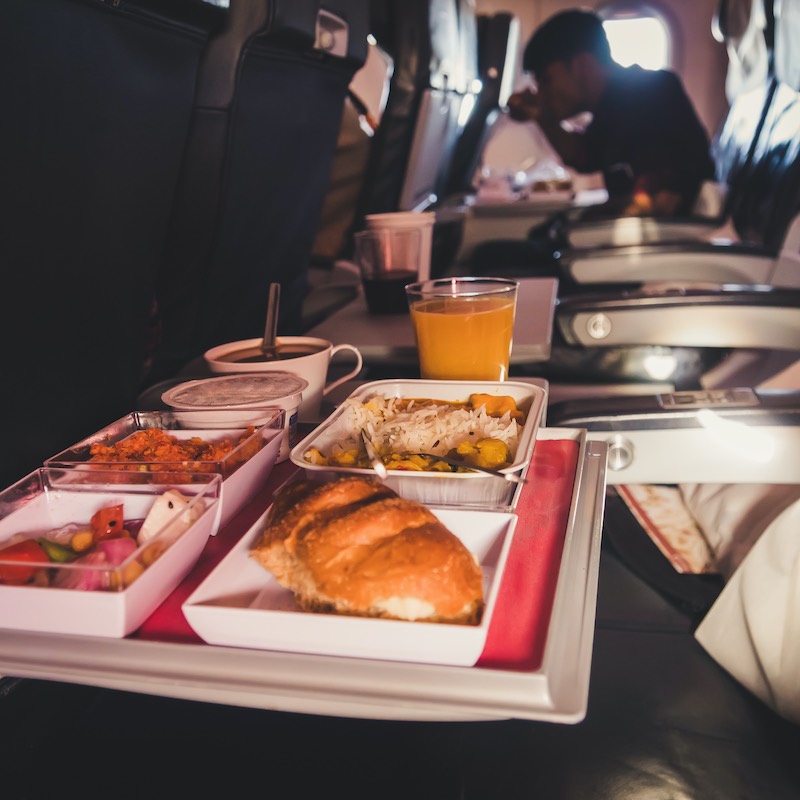 Tray of food. The passenger eats food on Board the plane 