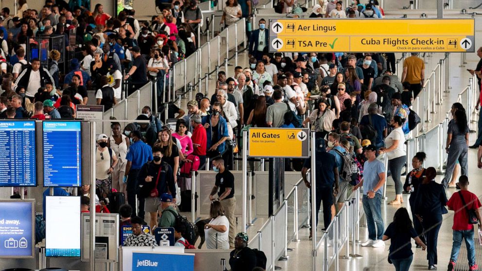 PHOTO: In this June 28, 2022, file photo, people wait in a TSA line at the John F. Kennedy International Airport in New York.