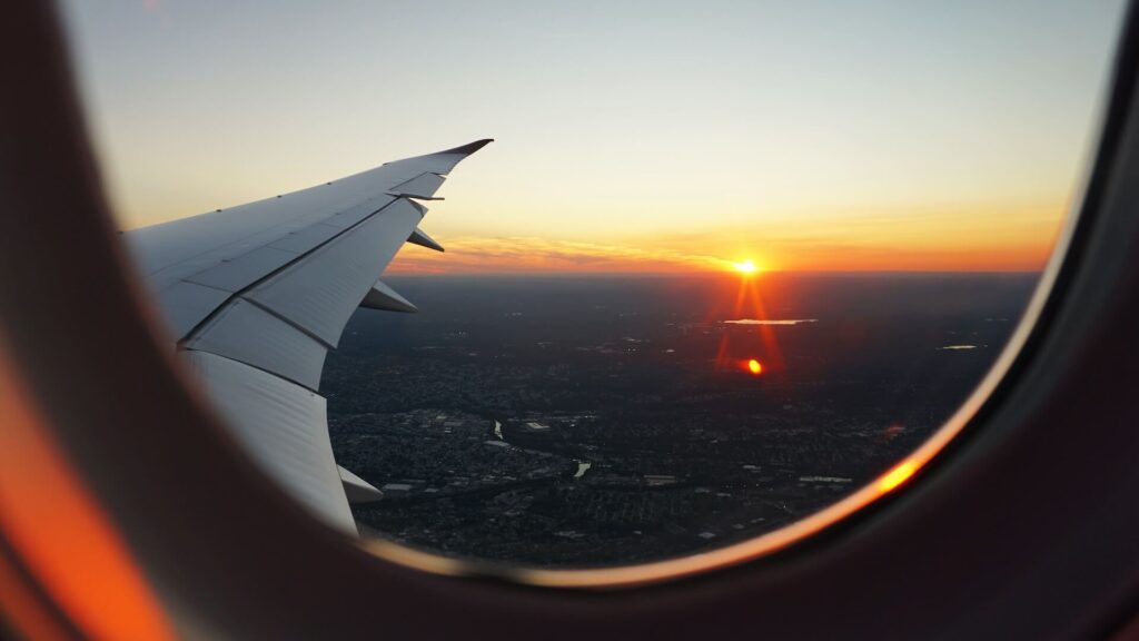 view of sky and sun through plane window