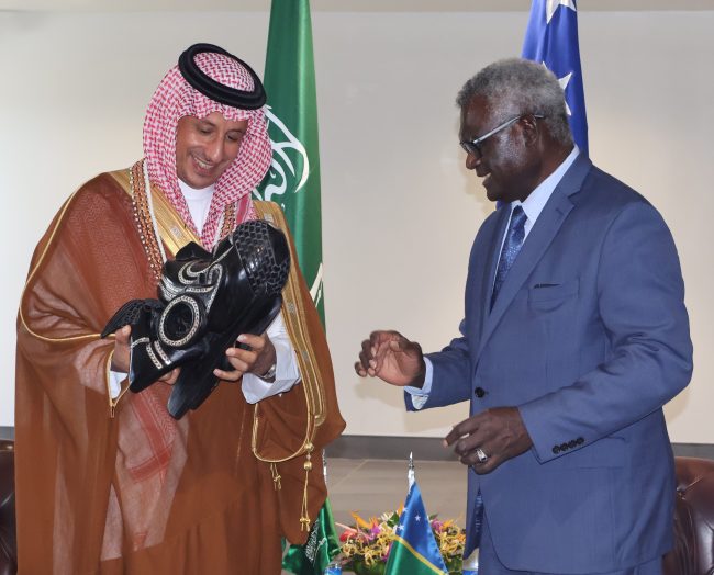 PM Sogavare handing over a traditional gift to H.E Ahmed Al Khateeb - Travel News, Insights & Resources.