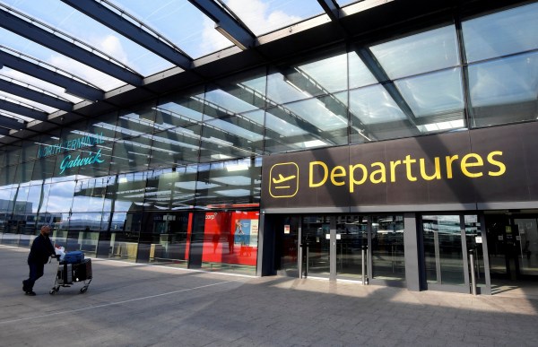 FILE PHOTO: A passenger arrives at Gatwick Airport, Britain July 10, 2020. REUTERS/Toby Melville/File Photo