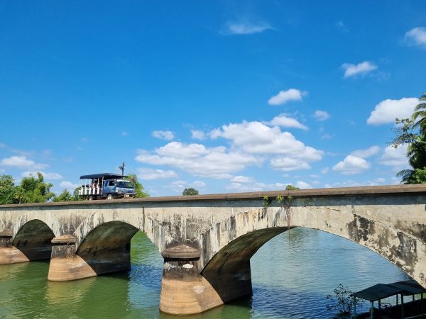 DonDet 06 A local tourist vehicle on a historic bridge - Travel News, Insights & Resources.