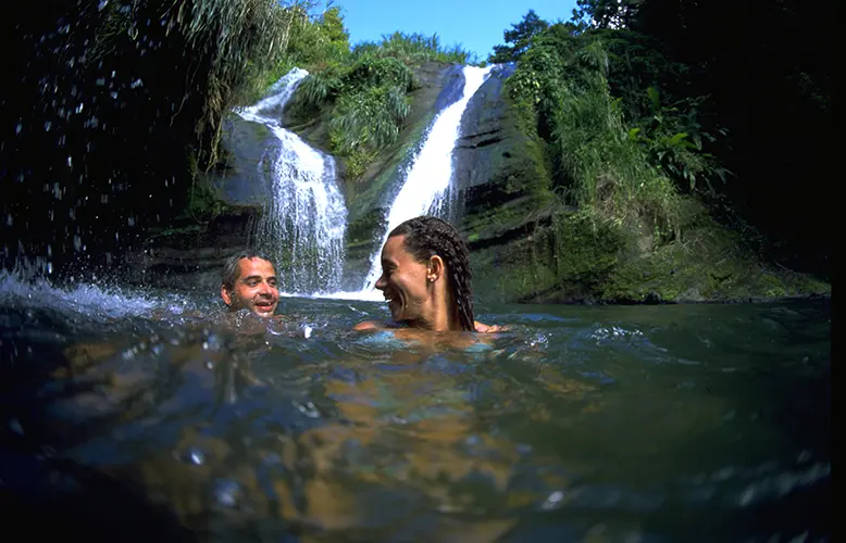 Couple at Concord Waterfalls copy.webp - Travel News, Insights & Resources.