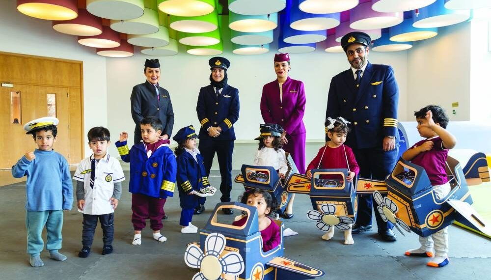 QF early education students interact with Qatar Airways crew - Travel News, Insights & Resources.