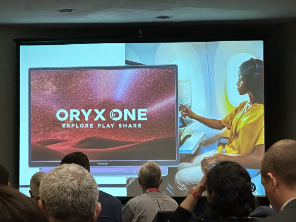 Qatar Airways' ORYX ONE IFE brand is shown on the Panasonic Astrova IFE screen. This is a slide that Cai presented at APEX TECH.