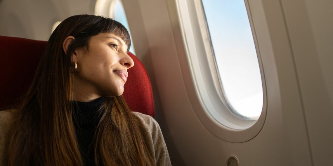 amadeus woman plane travel 1 - Travel News, Insights & Resources.