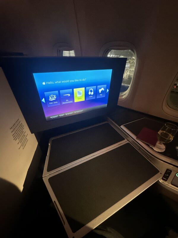 a screen on the seat of an airplane