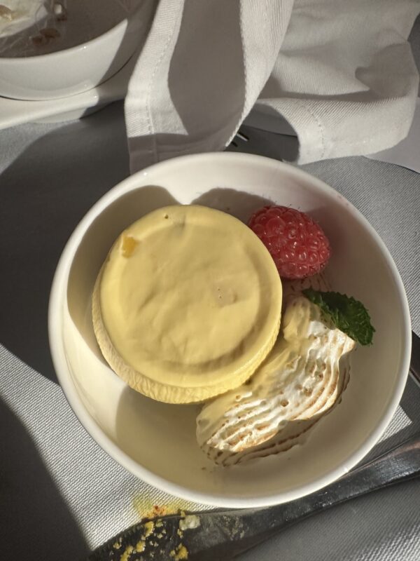 a bowl of food with a spoon and fork