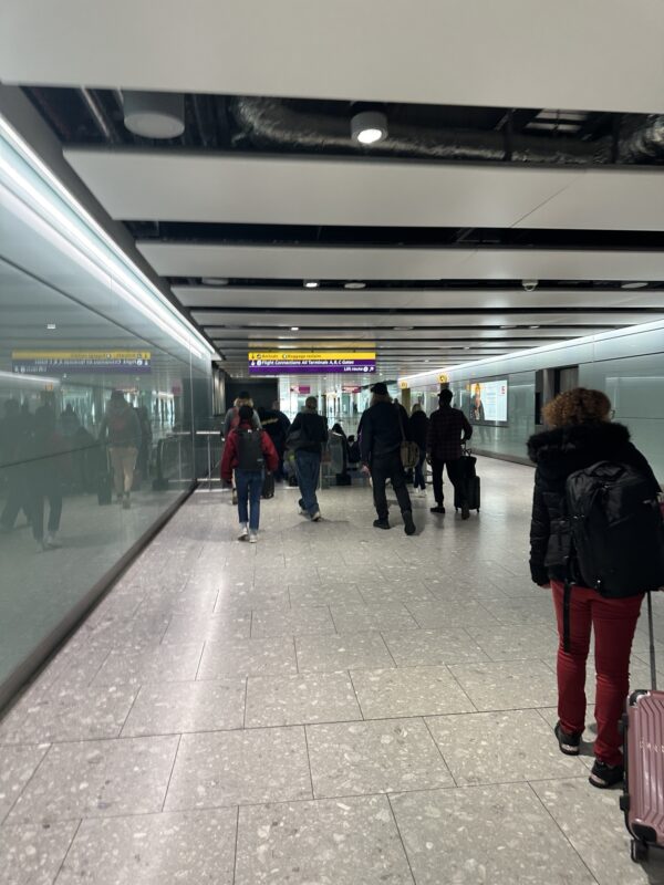 a group of people walking in a building