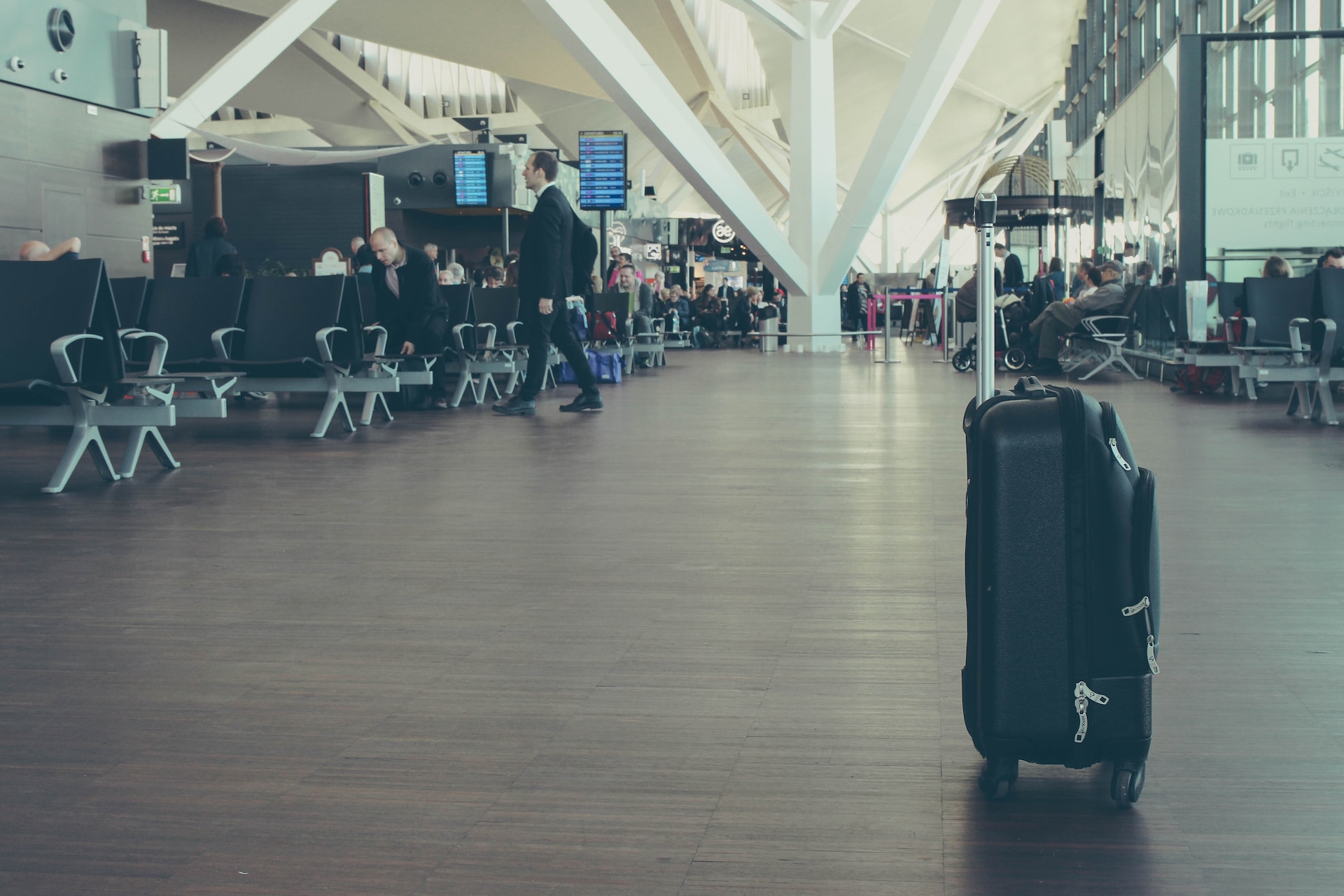 A piece of luggage sitting in the middle of an airport.