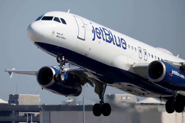 <p> Joe Raedle/Getty</p> A JetBlue Airways plane takes off