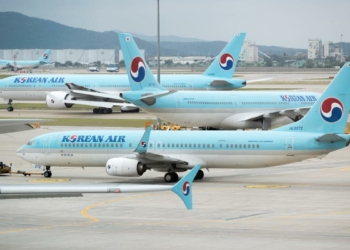 Boarding pass please Now stand on this scale Korean Air - Travel News, Insights & Resources.