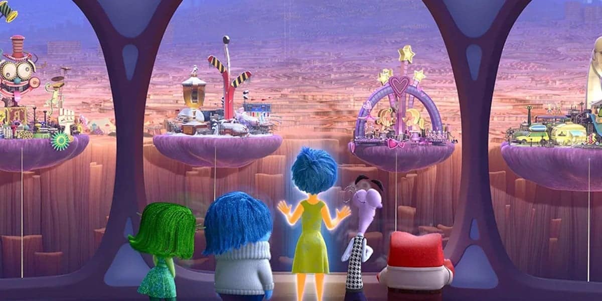 Five animated characters are looking out at a vibrant, whimsical cityscape filled with various imaginative structures resembling a dreamland, during twilight. (From Inside Out)
